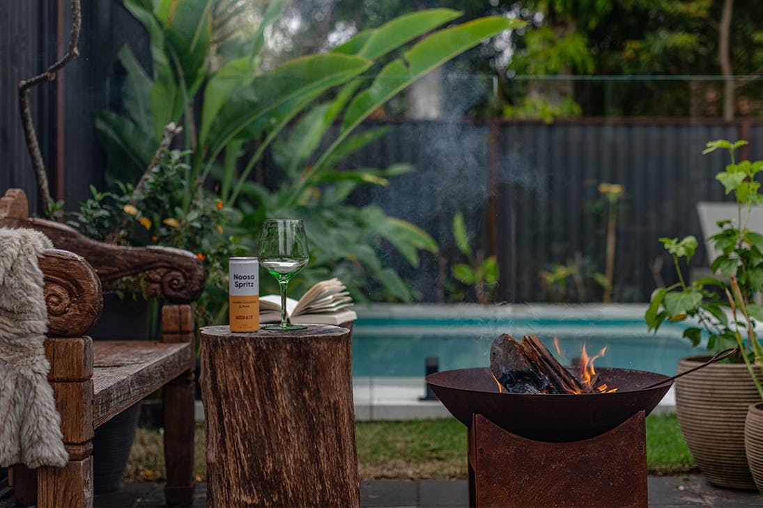 a fireplace in front of a pool
